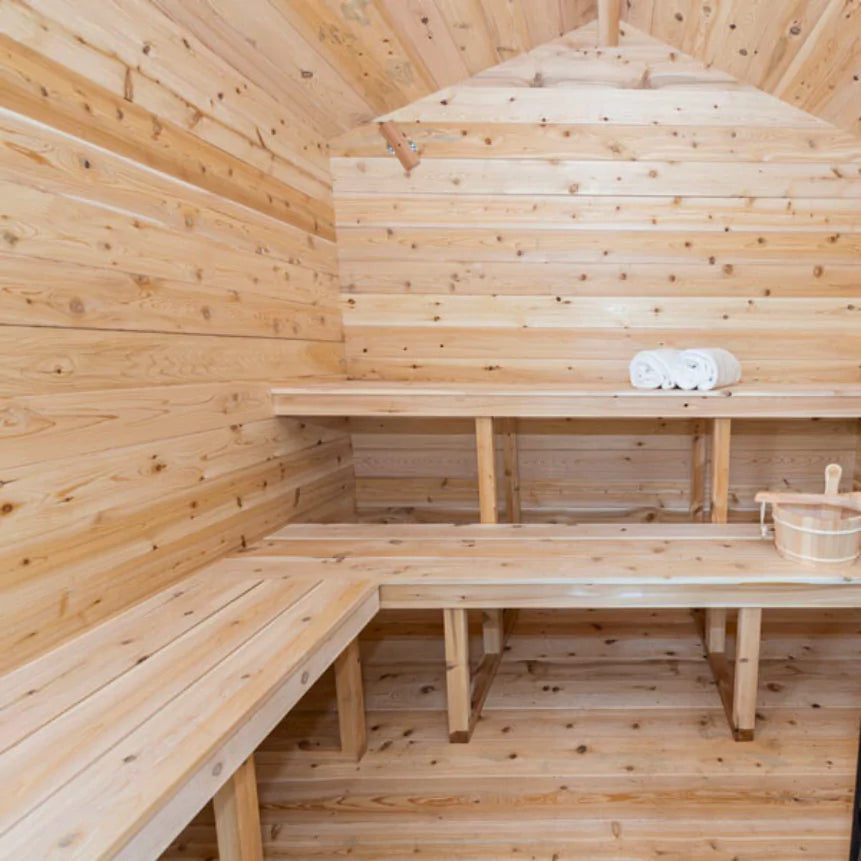 Georgian wooden cedar cabin with benches and towels.